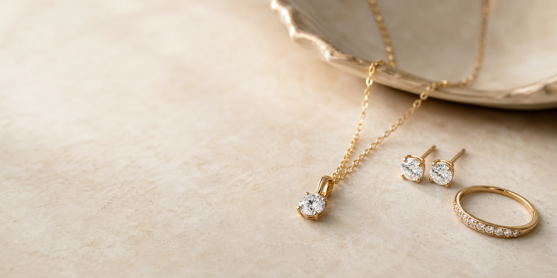Lab-grown diamond jewelry still life on warm stone
